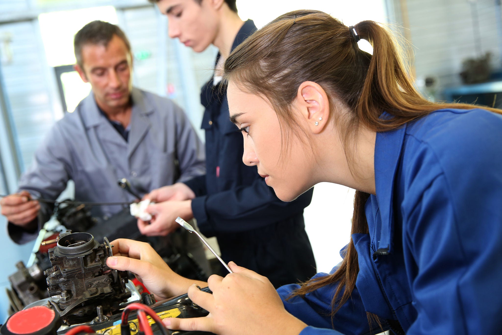 Mechanics training class with teacher and students